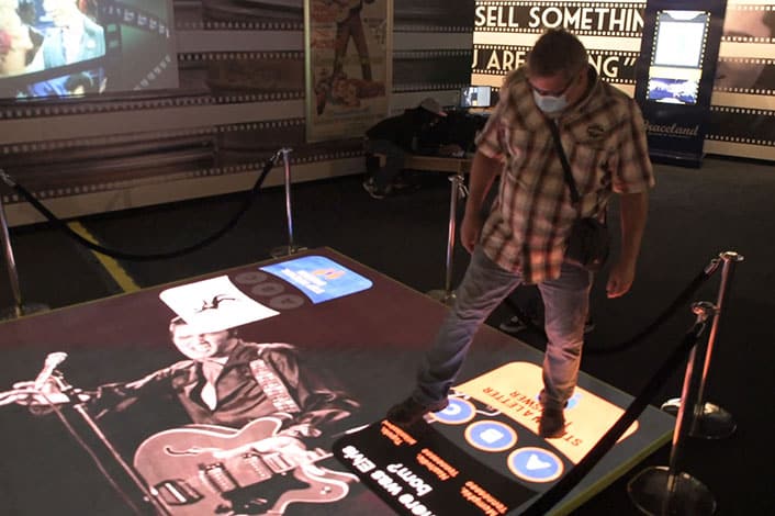man stands on interactive led floor
