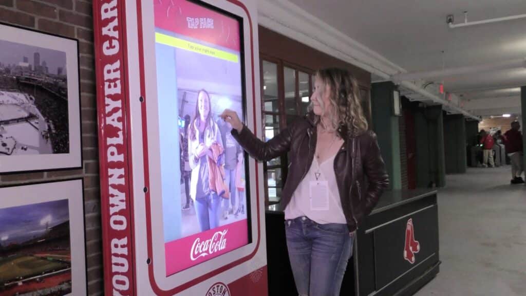 woman touching interactive led screen