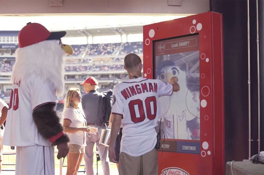 baseball fan touching interactive screen